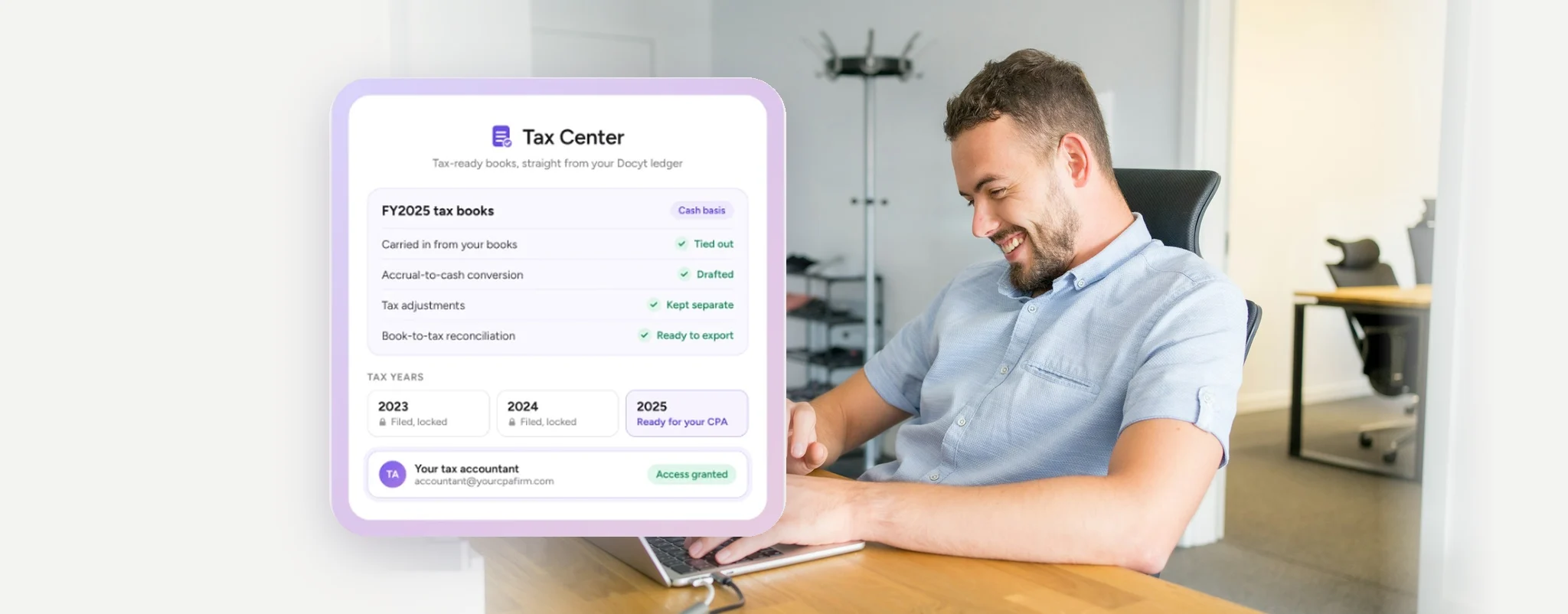 Finance professional at a laptop beside the Docyt Tax Center tax books card